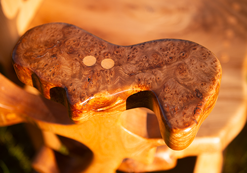 A chair detail of a crafted wooden chair by Wood Art