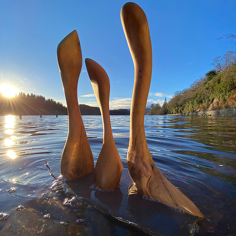 Wooden sculptures in a Scottish Loch by Wood Art
